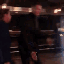 a blurry picture of a group of people standing next to each other