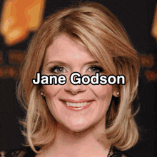 a close up of a woman 's face with the name jane godson written above her