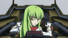 a girl with green hair and white gloves is sitting in a vehicle