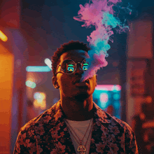 a man in a floral jacket is smoking a cigarette with a reflection of the letter g in his sunglasses