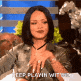 a woman is sitting on a couch and saying `` keep playin wit me ''