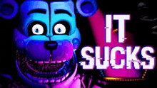a blue and purple teddy bear with the words `` it sucks '' written on it 's face .