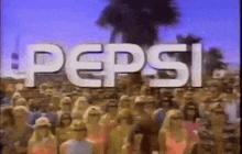 a crowd of people are standing in front of a large pepsi sign