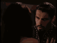 a man with a beard is talking to a woman with yeah sure written on the bottom