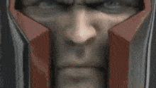 a man in a superhero costume is standing with his arms outstretched .
