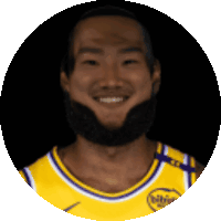 a man with a beard is wearing a yellow jersey that says phillies