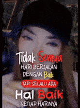 a woman wearing a black hat with a quote that says tidak semua hari berjalan dengan baik