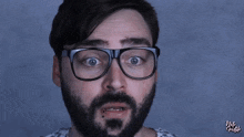 a close up of a man wearing glasses with the words vote galile written on the bottom