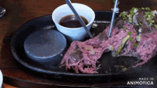 a close up of a plate of food with the words made in animatica on the bottom
