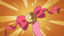 a gold coin with a star on it is on a pink ribbon