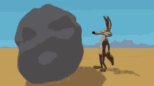 Coyote Pushing GIF - Coyote Pushing Rock GIFs