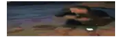 a blurry picture of a person standing on a grassy field .