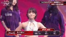 a female wrestler is standing in front of a screen that says 5 star gp 2021