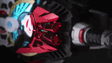 a close up of a toy with a red and blue item