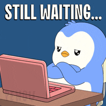 a penguin sits at a desk with a laptop and the words still waiting
