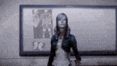 a woman in a video game is standing in front of a white board with a picture of a skeleton on it .