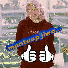 a woman wearing a red hoodie with the words hello b mantaap jiwa on it