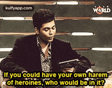 a man is sitting at a table holding a tablet and talking about heroines .