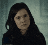 a close up of a woman 's face with her eyes closed
