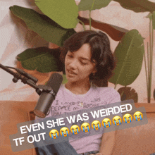 a woman sits on a couch in front of a microphone with a caption that says " even she was weirded "