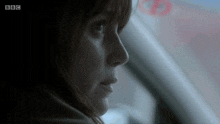 a close up of a woman 's face with the bbc logo on the bottom