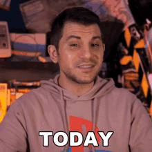 a man is wearing a hoodie that says today on it