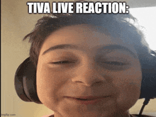 a young boy wearing headphones is making a funny face with the caption tiva live reaction