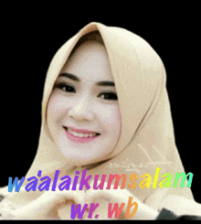 a woman wearing a hijab is smiling and making a heart shape with her hands and the words waalaikumsalam wr.wb behind her