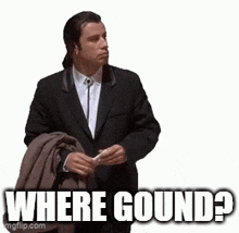 a man in a suit is holding a jacket and says where gound .