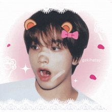 a picture of a boy with a pink bow on his head and the name gekihatsu