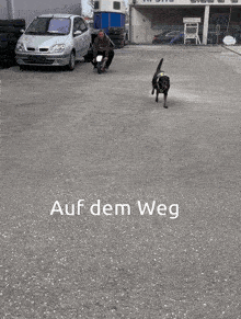 a man is kneeling down on a small motorcycle with the words auf dem weg written below him