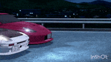 a red car with a license plate that says 13-137 is parked next to another car
