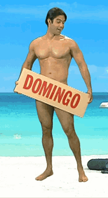 a naked man holds a sign that says domingo