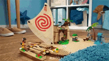 a lego sailboat with a swirl on the sail