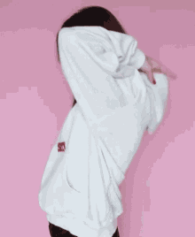 White Hoodie Sweater Curl Up GIF - White Hoodie Sweater Curl Up Feeling Comfortable GIFs