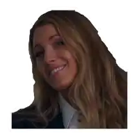 a close up of a woman 's face smiling