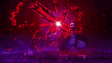 a blurry picture of a red flower with a purple background