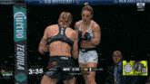 two women are fighting in a cage with a banner that says tequila