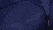 a pixelated image of a person holding a sword in a dark room