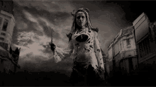 a black and white photo of a woman in a zombie costume holding a knife