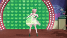 a girl in a green dress is dancing in front of a green background with hearts on it