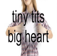 a woman in a plaid shirt is holding her chest and the words tiny tits big heart are visible