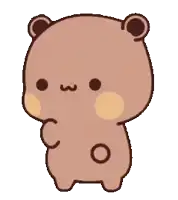 a brown teddy bear with a red heart on its face