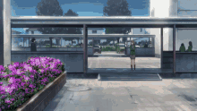 a girl standing in front of a building with purple flowers in the foreground