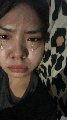 a woman with tears coming out of her eyes