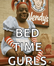 a wendy 's sign is behind a woman dressed as wendy 's wendy