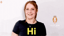 a woman wearing a black t-shirt that says hi