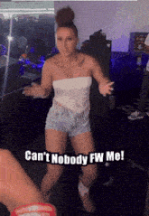 a woman is dancing in a room with the words can 't nobody fw me