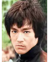 a close up of a person 's face with a serious look on his face