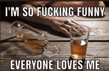 a bottle of whiskey and a glass of whiskey on a table